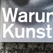 Lower left section of the catalog "Warum Kunst", white typography on black and white drawing.